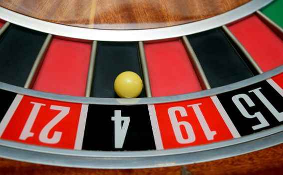 ball in winning number four at roulette wheel