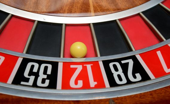 ball in winning number twelve at roulette wheel
