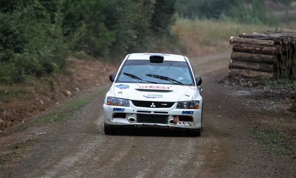 KOCAELI, TURKEY - AUGUST 23, 2015: Simin Bicakcioglu with Mitsubishi Evo IX of Neo Motorspor Team in Kocaeli Rally 2015
