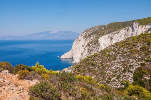 Beautiful cliff coast of Zakynthos seen from the top with Cephalonia Island in the background