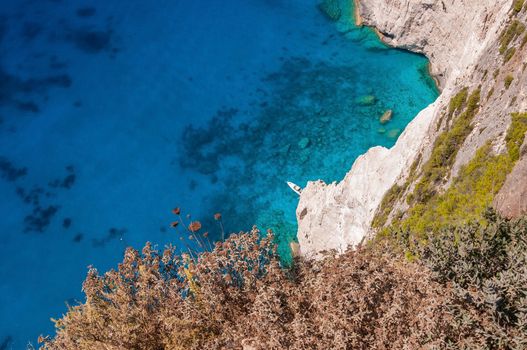 Motorboat at the cliffs of Zakynthos seen from the top