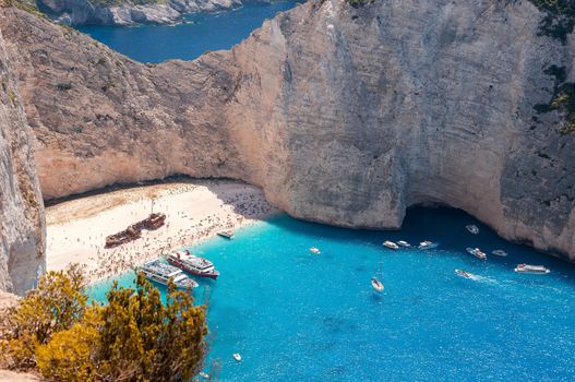 Crowded Navagio Beach on Zakynthos seen from the cliff