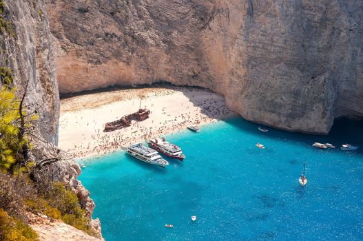 Crowded Navagio Beach on Zakynthos seen from the cliff