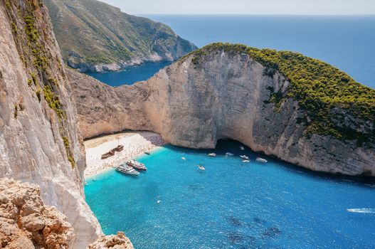 Crowded Navagio Beach on Zakynthos seen from the cliff