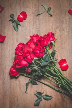 Valentines Day of Red rose on wooden background