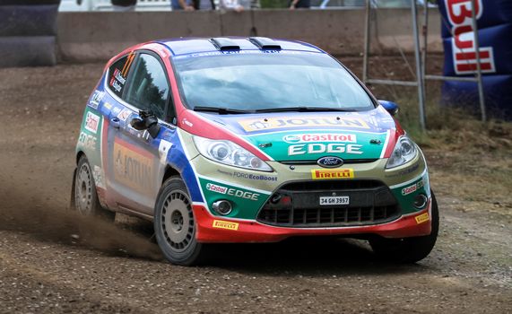 KOCAELI, TURKEY - AUGUST 23, 2015: Umit Can Ozdemir with Ford Fiesta R2 of Castrol Ford Team Turkiye in Kocaeli Rally 2015
