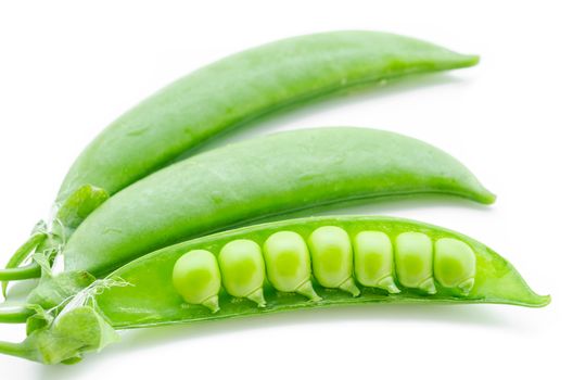 fresh green peas on a white background