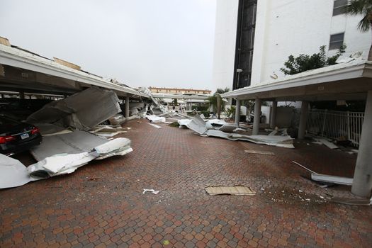 UNITED STATES, Siesta Key: A heavily damaged car park is seen in the aftermath of a tornado, on Midnight Pass Road in Siesta Key, Florida, on January 17, 2016. At least two people are dead near Sarasota after tornadoes and severe thunderstorms crossed central and South Florida on January 17, 2016. 