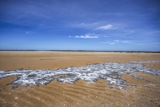 Interesting rock formations in the sand at low tide