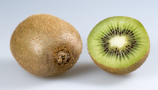 Kiwifruit Close Up. One sliced and one whole one.