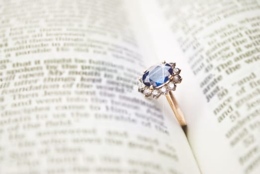 wedding ring on the old book