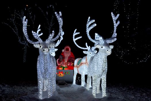 The photograph depicts Santa Claus in a sleigh