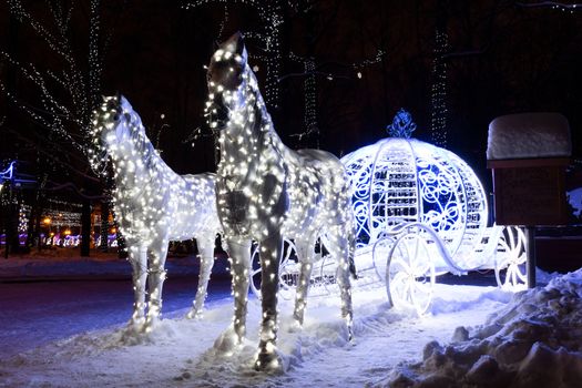 The photo shows a horse with a coach