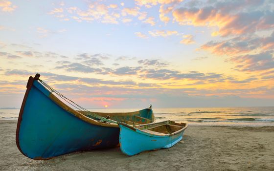 Two fisherman boats at sunrise time