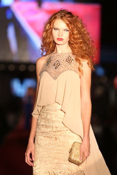 ISTANBUL, TURKEY - AUGUST 25, 2015: A model showcases one of the latest creations in Laleli Fashion Shopping Festival