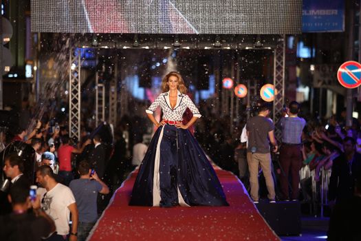 ISTANBUL, TURKEY - AUGUST 25, 2015: A model showcases one of the latest creations in Laleli Fashion Shopping Festival