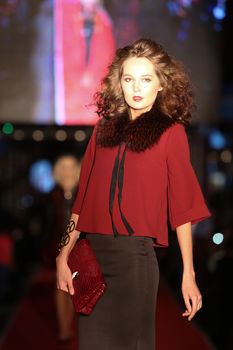 ISTANBUL, TURKEY - AUGUST 25, 2015: A model showcases one of the latest creations in Laleli Fashion Shopping Festival