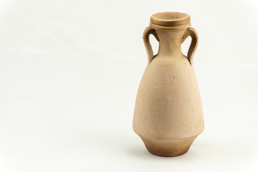 Ancient terracotta vase isolated on white background