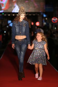 ISTANBUL, TURKEY - AUGUST 25, 2015: A model showcases one of the latest creations in Laleli Fashion Shopping Festival