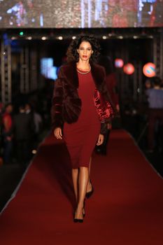 ISTANBUL, TURKEY - AUGUST 25, 2015: A model showcases one of the latest creations in Laleli Fashion Shopping Festival
