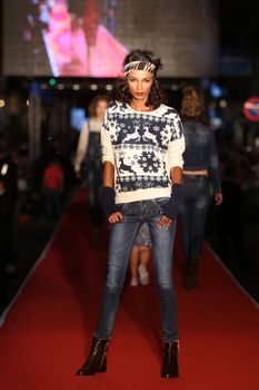 ISTANBUL, TURKEY - AUGUST 25, 2015: A model showcases one of the latest creations in Laleli Fashion Shopping Festival