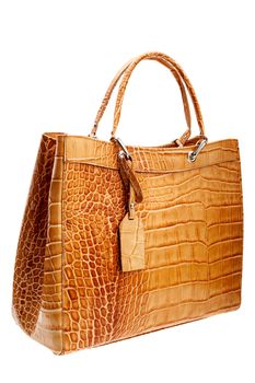 New Brown leather womens bag with crocodile texture isolated on white background.