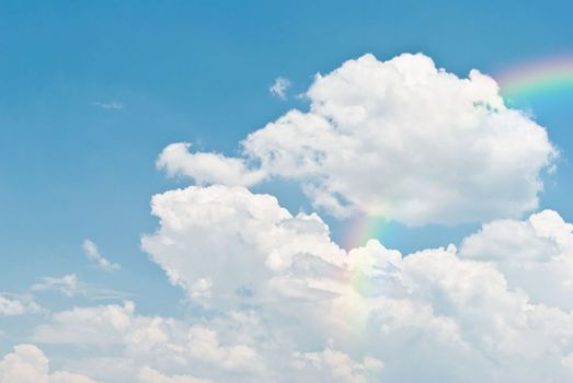 rainbow in the blue sky after the rain