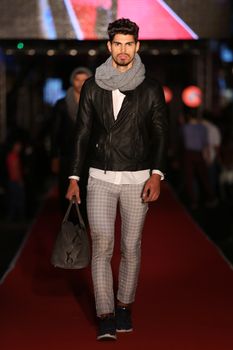 ISTANBUL, TURKEY - AUGUST 25, 2015: A model showcases one of the latest creations in Laleli Fashion Shopping Festival