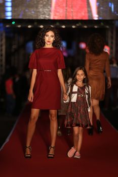 ISTANBUL, TURKEY - AUGUST 25, 2015: A model showcases one of the latest creations in Laleli Fashion Shopping Festival