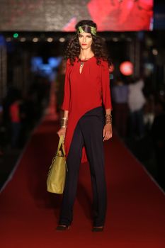 ISTANBUL, TURKEY - AUGUST 25, 2015: A model showcases one of the latest creations in Laleli Fashion Shopping Festival