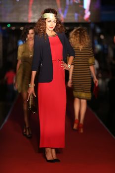 ISTANBUL, TURKEY - AUGUST 25, 2015: A model showcases one of the latest creations in Laleli Fashion Shopping Festival