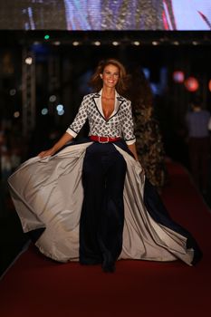 ISTANBUL, TURKEY - AUGUST 25, 2015: A model showcases one of the latest creations in Laleli Fashion Shopping Festival