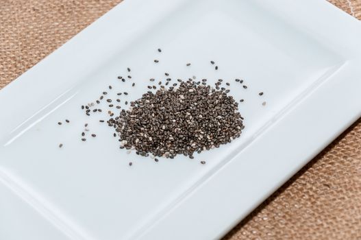 Chia seeds on a white plate