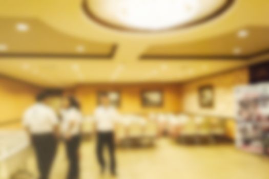 Abstract blurred people in conference room, education concept