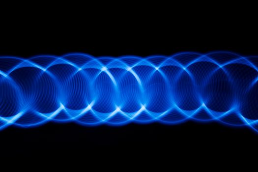 Sound waves in the visible blue color in the dark