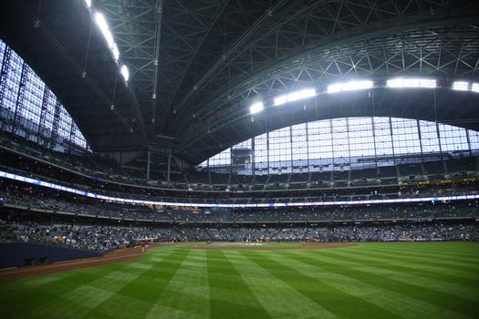 Brewers fans await a baseball game at Miller Park against the Chicago Cubs under a closed dome.