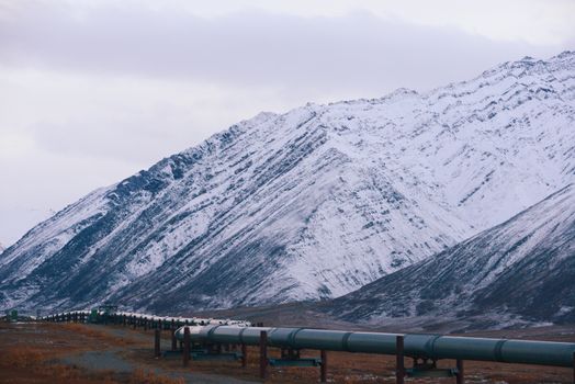 oil pipeline with mountain in northern alaska