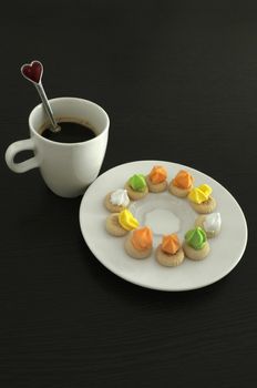 Hot coffee and thai traditional cookies on wooden background