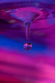 Blue and Purple water droplet captured with high speed lights
