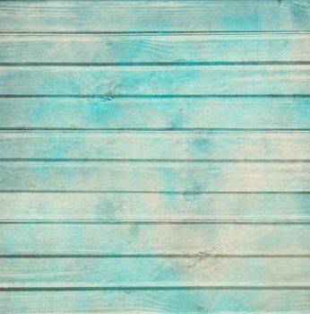 Rustic old plank background in turquoise, mint and beige colors with textured scratches and antique cracked paint for scrapbooking and decoupage