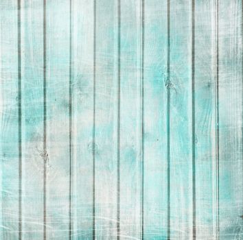 Rustic old plank background in turquoise, mint and beige colors with textured scratches and antique cracked paint for scrapbooking and decoupage