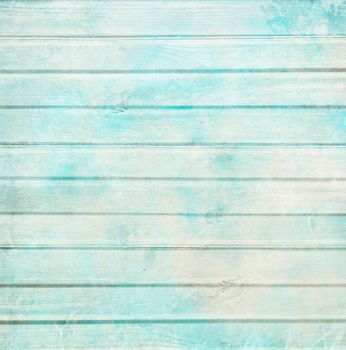 Rustic old plank background in turquoise, mint and beige colors with textured scratches and antique cracked paint for scrapbooking and decoupage