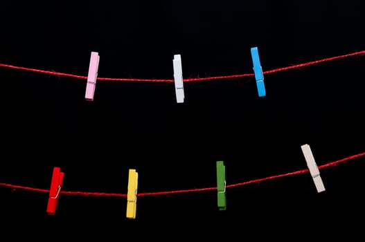 Tweezers color on a red string