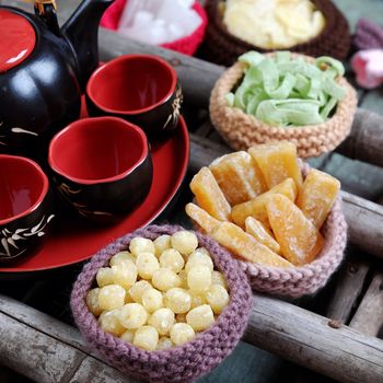 Vietnamese food for Tet holiday in spring, jam is traditional food on lunar new year, can make from sweet potato, lotus seed, ginger with suger, colorful background for Vietnam custom
