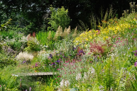 Garden scene resonant of such a sight all over the world where people sculpt,design and tend thier little piece of heaven