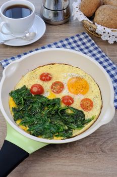 Fried tomatoes and spinach with cheese