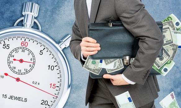 Businessman with suitcase full of money and timer