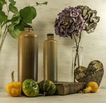 stil life  with stone bottles on wooden background