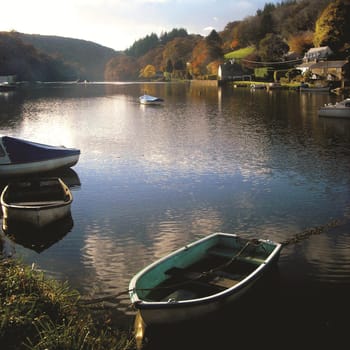 The peaceful evening as dusk falls over the Fowey river at Leryn, Cornwall UK.