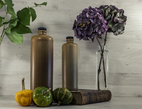 stil life  with stone bottles on wooden background